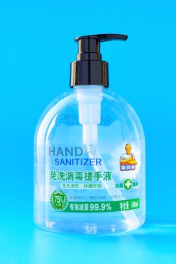 ZhongShan China-February 22,2020:75 percent disinfectant alcohol hand sanitizer on blue background.