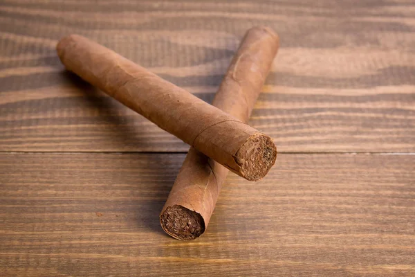 Cuban cigars on a dark wooden background — Stock Photo, Image