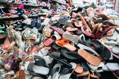 Bangkok, Thailand - November 28, 2019: Piles of shoes and sandal