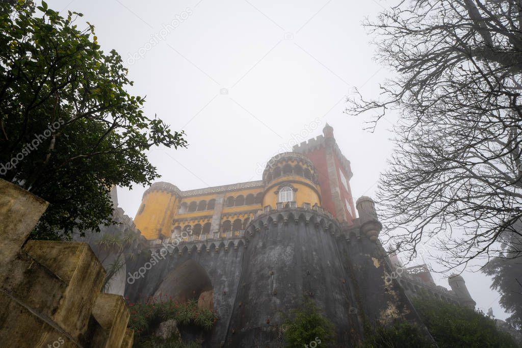 Extremely foggy view of the famous yellow Pena Palace during win