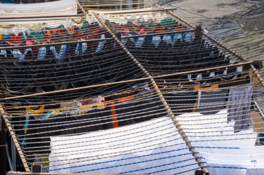 Mumbai, India - Feburary 29, 2020: The Dhobi Ghat is a well known open air laundromat where thousands of people work daily washing and drying clothing and linens