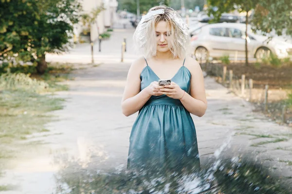 Girl with a haircut. Young woman with pigeons. An early walk of the city\'s streets. Sunrise in the city.