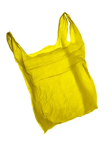 Saco de plástico amarelo no fundo branco. Isolados — Fotografia de Stock