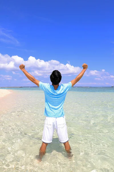 Young man on beach — Stock Photo, Image