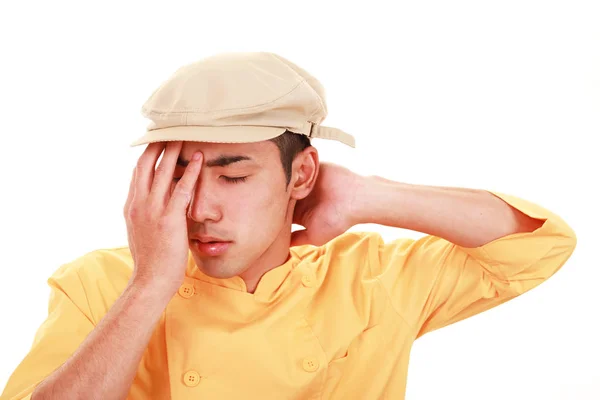 Tired Asian waiter — Stock Photo, Image