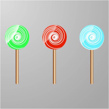 Gri arka plan üzerinde üç renkli lolipop