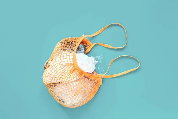 Crochet net bag with plastic bags, creative eco flat lay