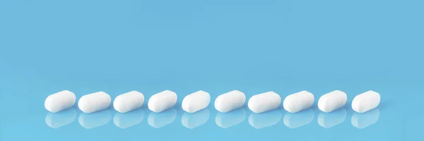 Several White Tablets Pills Row Blue Glass Reflection Copy Space — Stock Photo, Image