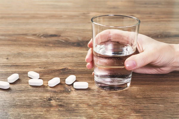 Hand White Tablets Pills Lined Wooden Table Glass Water Pharmacy — Stock Photo, Image