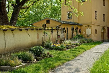 A picturesque row of old graves in the courtyard of the Nonnberg Abbey in Salzburg, Austria clipart