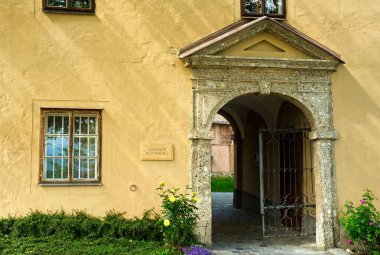 The outer gate to the Nonnberg Abbey (Stift Nonnberg) in Salzburg, Austria; the gateway leads to a courtyard garden, with the church just beyond clipart