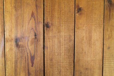 Dikey tahtaları olan eski kahverengi ahşap arkaplan.