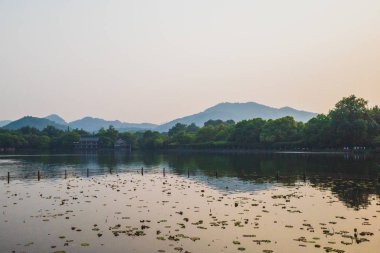 West Lake landscape with reflections in water at sunset, Hangzho