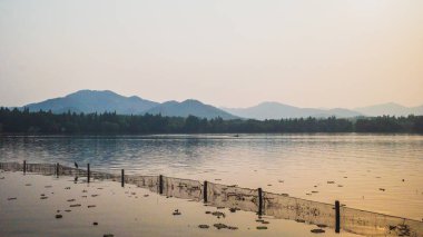 West Lake landscape with reflections in water at sunset, Hangzho