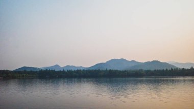 West Lake landscape with reflections in water at sunset, Hangzho