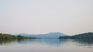 West Lake landscape with reflections in water at sunset, Hangzho