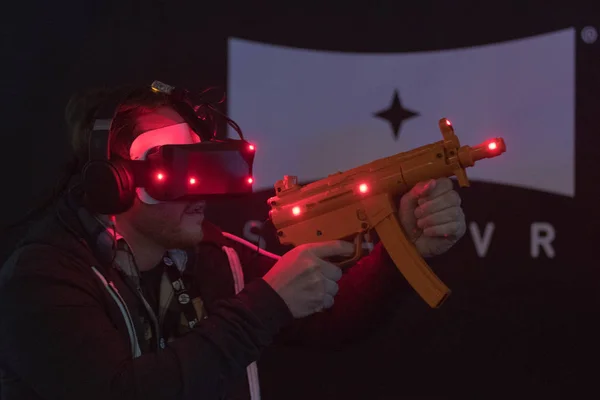 Close-up of man using vr glasses and weapon gun — Stock Photo, Image