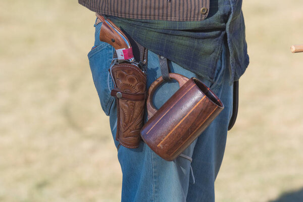 Participant with scenographic gun during Tumbleweed Festival