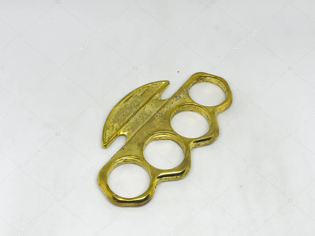 Brass knuckles, white background.