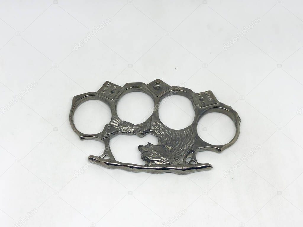 Brass knuckles, white background.