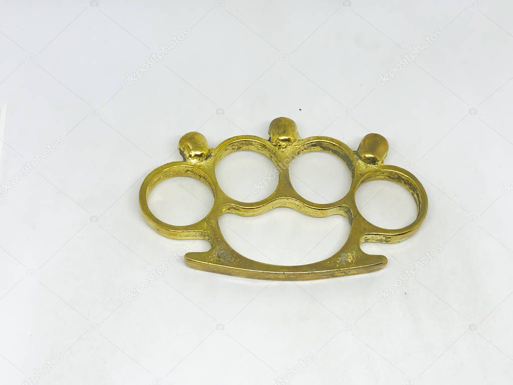 Brass knuckles, white background.