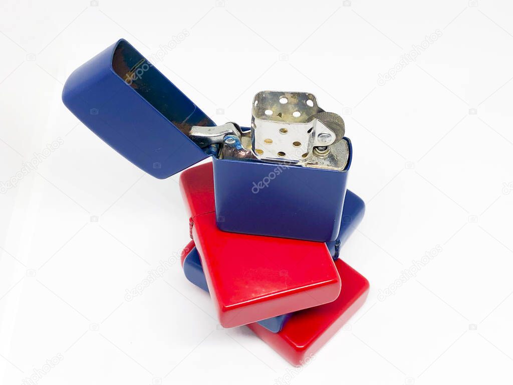 Various lighters and box, white background.