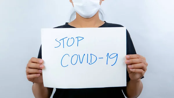 Women Holding Label Stop Covid — Stock Photo, Image