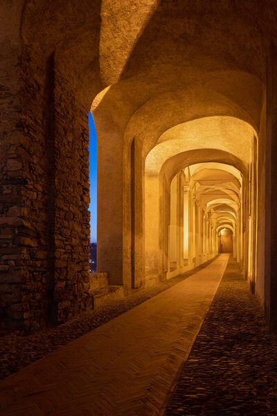 Archway in old town of Imperia in the night, Liguria region, Italy