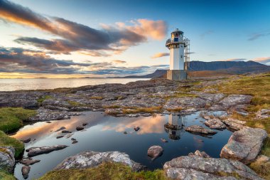 Sunset over Rhue Lighthouse  clipart