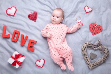 Valentine's day picture with baby girls on grey. Top view clipart