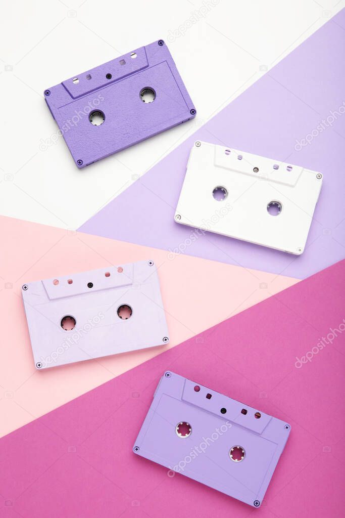 Old colorful cassettes on a colorful background. Music day, top view