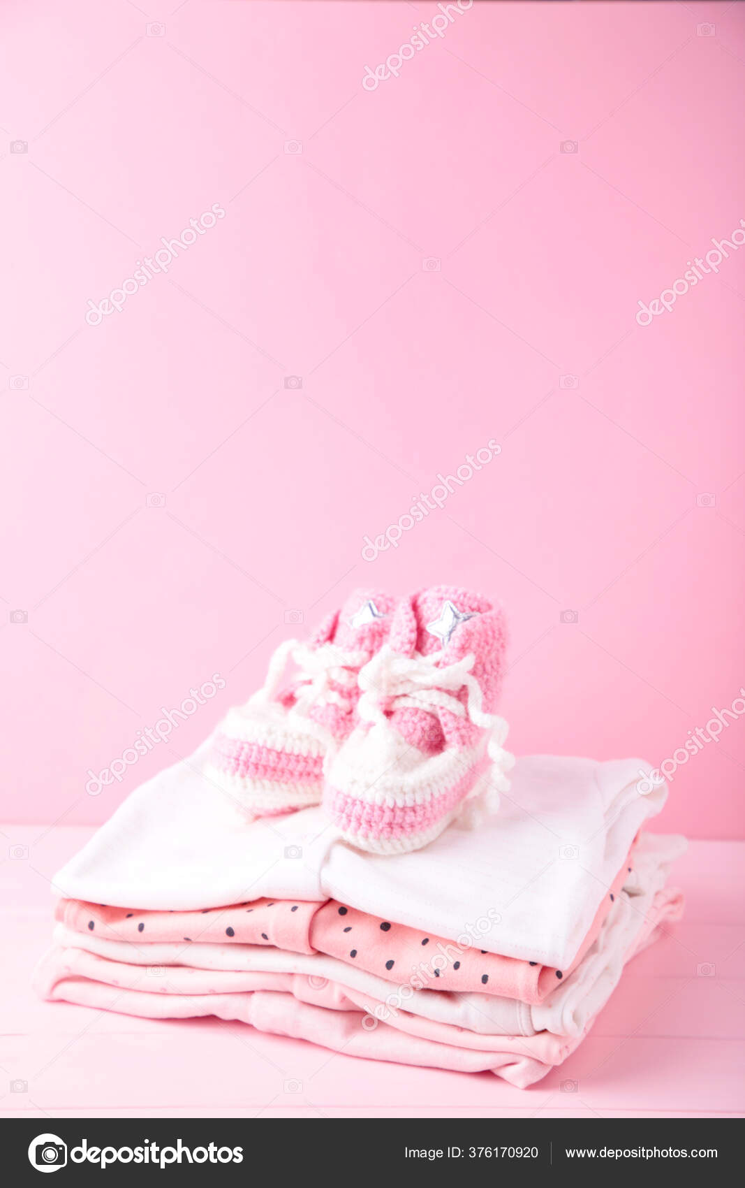 Baby Clothes Booties Pink Background Copy Space Top View Stock Photo by  ©Mouse_family 376170920
