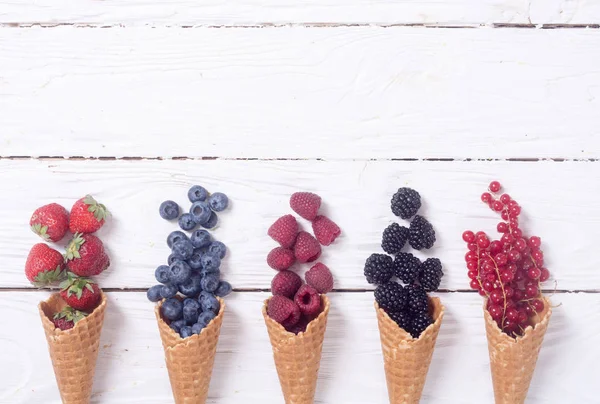 Berries in ice cream cone — Stock Photo, Image