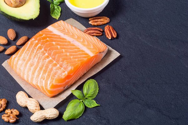 Healthy food vegetables , nuts and salmon 