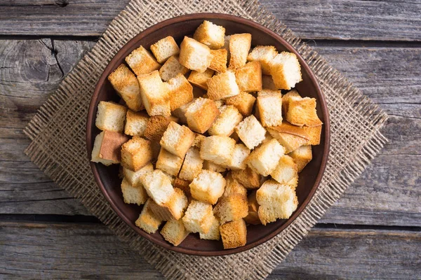 Crispy croutons in bowl — Stock Photo, Image