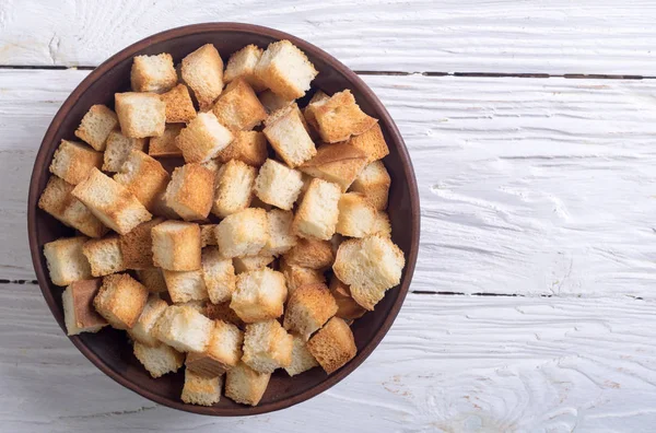 Crispy croutons in bowl — Stock Photo, Image