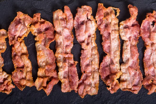 Smažené plátky slaniny — Stock fotografie