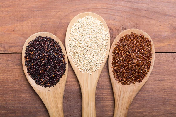 Black , white and red quinoa in spoon — Stock Photo, Image