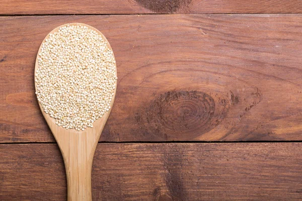 White quinoa in spoon — Stock Photo, Image