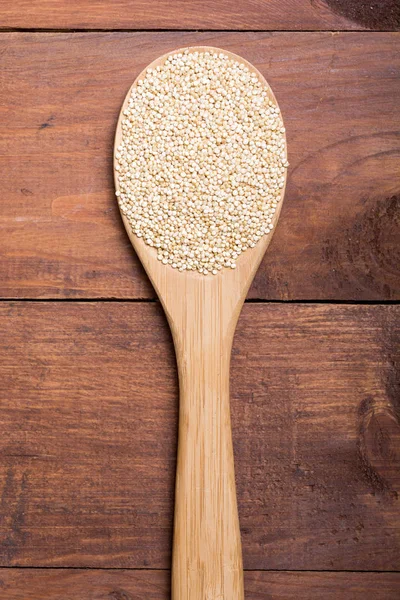 White quinoa in spoon — Stock Photo, Image