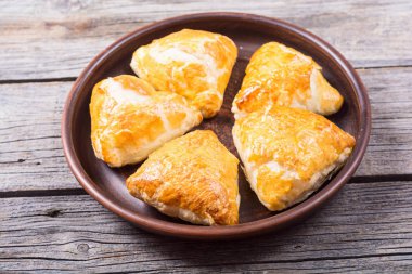 Freshly baked puff pastry samosa clipart