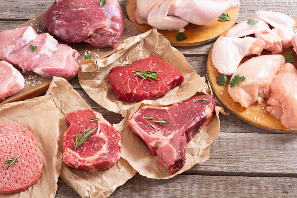 Assortment of meat and seafood . Beef , chicken , fish and pork