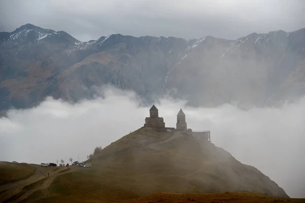 Gergeti Trinity Church in clouds — Stock Photo, Image