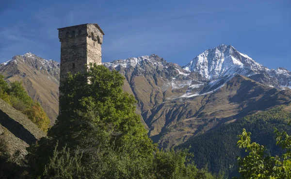 Old stone tower among high mountains — Stock Photo, Image