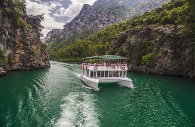 Manavgat, Antalya Province/ Turkey -  07.06.2018. Boat trip in Green Canyon. Vacations in mountains. clipart
