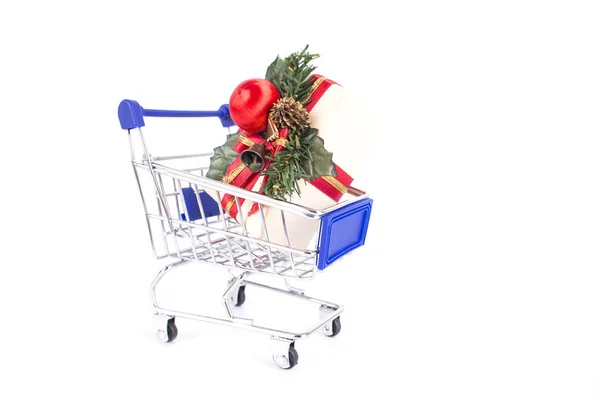 Shopping trolley with gift boxes decoration on a white backgroun — Stock Photo, Image