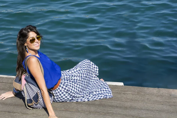 Portrait Of Beautiful Happy Woman on a Sea Background