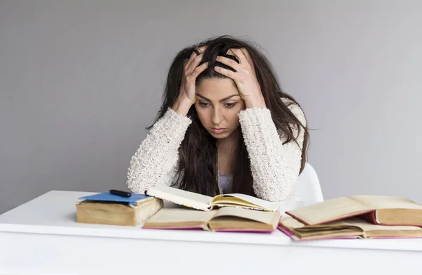 stock image Tired Student Woman with Headache Studying for Exams