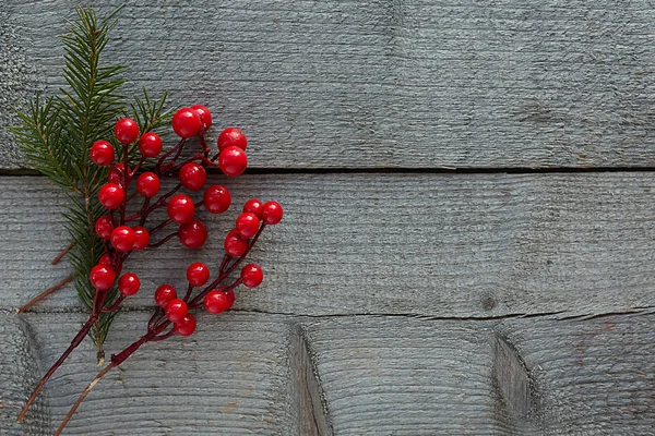 Red berries on a wooden background. Christmas composition. — Stock Photo, Image