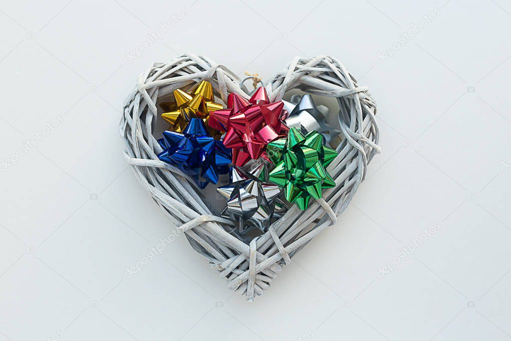 Festive composition. Star decoration for gifts and heart on a li